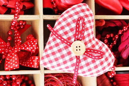 Red thread and material for handicrafts in box close-upの写真素材