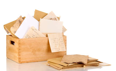 Wooden crate with papers and letters isolated on whiteの写真素材