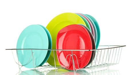 Color plates in rack isolated on whiteの写真素材