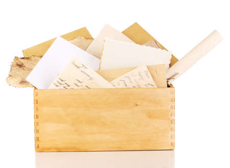 Wooden crate with papers and letters isolated on whiteの写真素材
