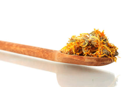 dried calendula flowers in wooden spoon, isolated on white
の写真素材