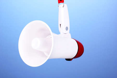red and white megaphone on blue backgroundの写真素材