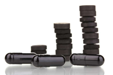 activated carbon in tablets isolated on whiteの写真素材