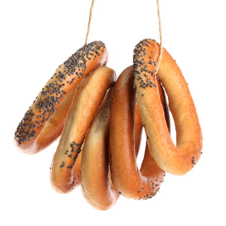 tasty bagels on rope, isolated on whiteの写真素材
