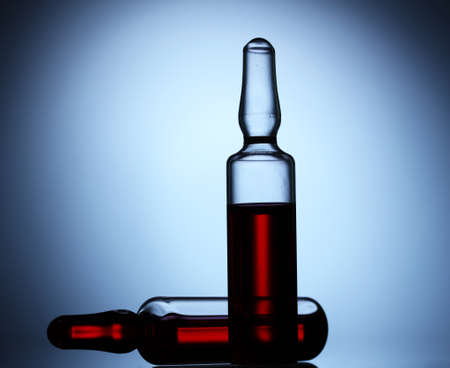 medical ampules on blue backgroundの写真素材
