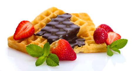 belgium waffles with strawberries and mint  isolated on whiteの写真素材