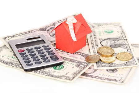 Small house and money isolated on whiteの写真素材