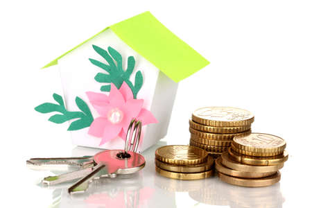 Small house with money and key isolated on whiteの写真素材