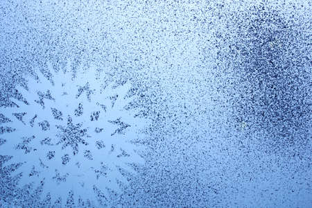 Snowflake pattern on windowの写真素材