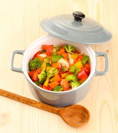 Vegetable stew in gray pot on wooden backgroundの写真素材