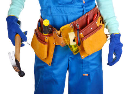 Male builder in blue overalls with gavel isolated on whiteの写真素材