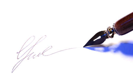Closeup of signature (fake, not real) and ink pen, isolated on whiteの写真素材