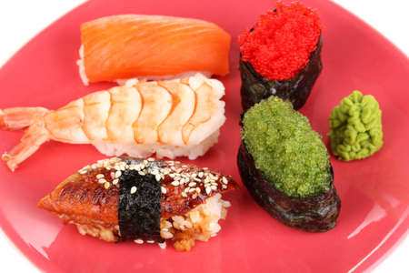 delicious sushi served on red plate close-upの写真素材