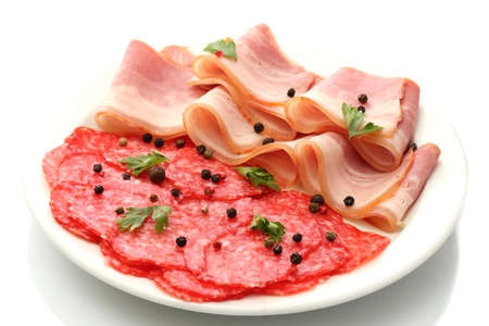 tasty bacon and sausage with spices on plate, isolated on whiteの写真素材