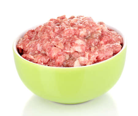 Bowl of raw ground meat isolated on whiteの写真素材