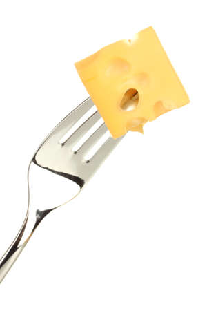 Cheese cube on fork isolated on whiteの写真素材