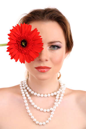 Beautiful young woman with bright make-up, holding flower, isolated on whiteの写真素材