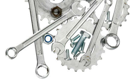 Machine gear, metal cogwheels, nuts and bolts isolated on whiteの写真素材