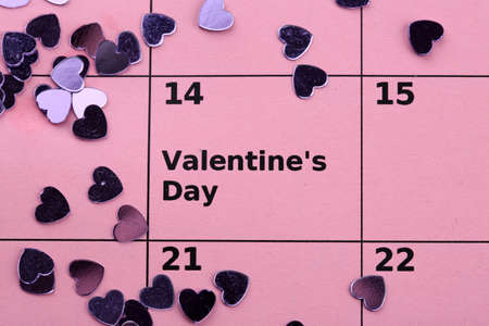 Notes on the calendar (valentines day) and rose, close-upの写真素材