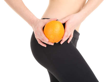 Beautiful female figure with orange isolated on whiteの写真素材