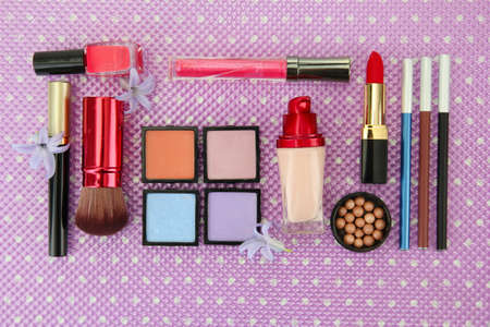 Decorative cosmetics on purple backgroundの写真素材