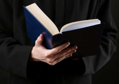 Priest reading from the holy bible, close upの写真素材