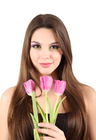 Young beautiful girl with tulips in her hand, isolated on whiteの写真素材