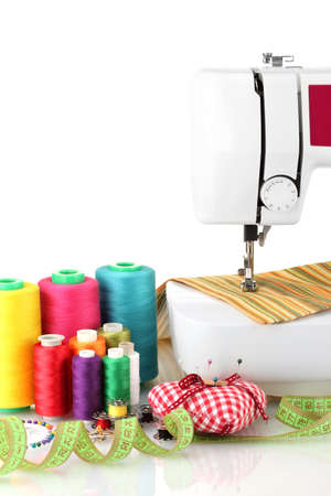 sewing machine and fabric isolated on whiteの写真素材