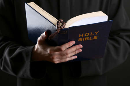 Priest reading from the holy bible, close upの写真素材