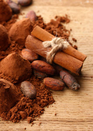 Composition of chocolate  truffles, cocoa and spices on wooden backgroundの写真素材