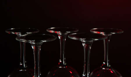 Glasses on dark red backgroundの写真素材