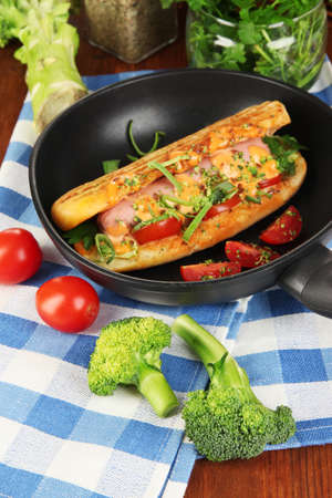 Delicious hot dog on grill close-upの写真素材