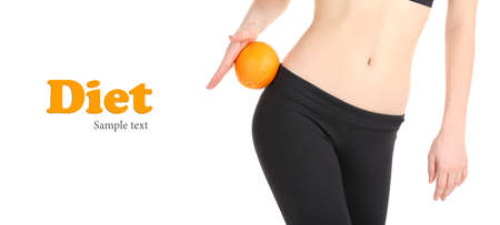 Beautiful female figure with orange isolated on whiteの写真素材