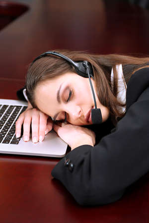 Asleep call center operator at workの写真素材