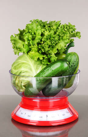 Fresh vegetables in scales on gray backgroundの写真素材