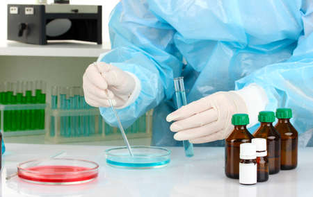 Scientist conducting research in laboratory close upの写真素材