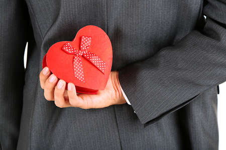 Young businessman present gift box, close upの写真素材