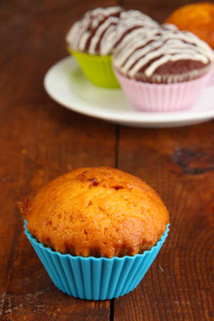 Sweet cupcakes on wooden tableの写真素材
