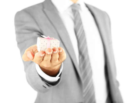 Young businessman present gift box, isolated on whiteの写真素材