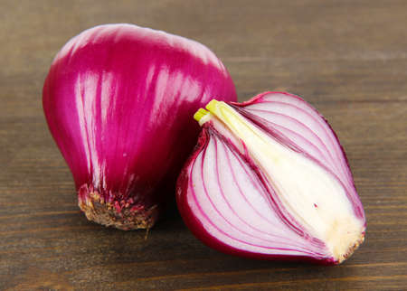 Purple onion on wooden backgroundの写真素材