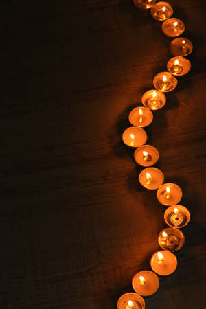 Burning candles on dark backgroundの写真素材