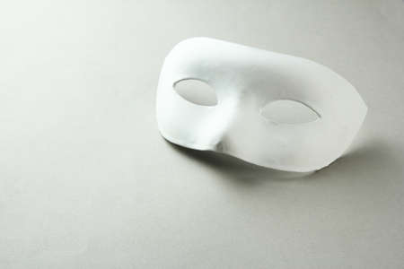 White mask, on grey backgroundの写真素材