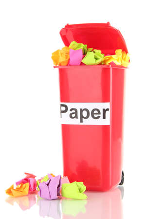 Recycling bin with papers isolated on whiteの写真素材