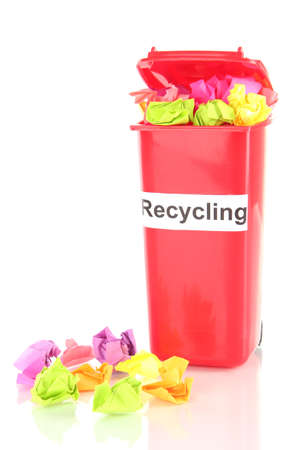 Recycling bin with papers isolated on whiteの写真素材