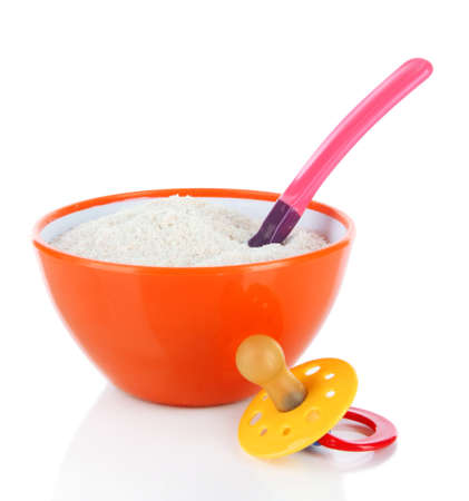 Powdered milk in bowl with spoon and nipple for baby isolated on whiteの写真素材