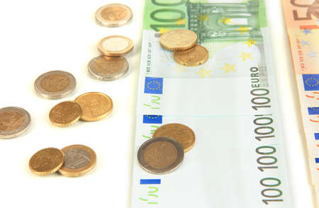 Euro banknotes and euro cents isolated on whiteの写真素材