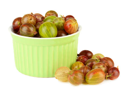 Fresh gooseberries in bowl isolated on whiteの写真素材