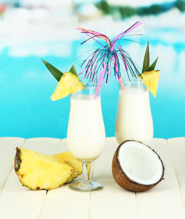 Pina colada drink in cocktail glasses, on bright backgroundの写真素材