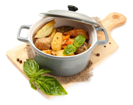 Homemade beef stir fry with vegetables in color pan, on wooden board, isolated on whiteの写真素材