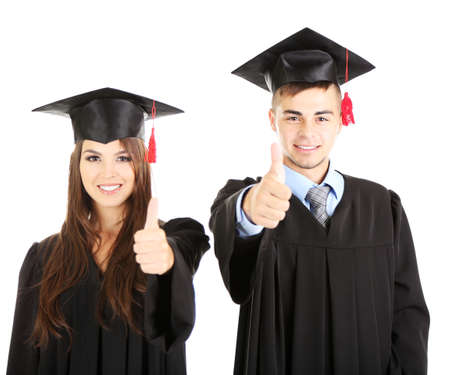 Two happy graduating students isolated on whiteの写真素材